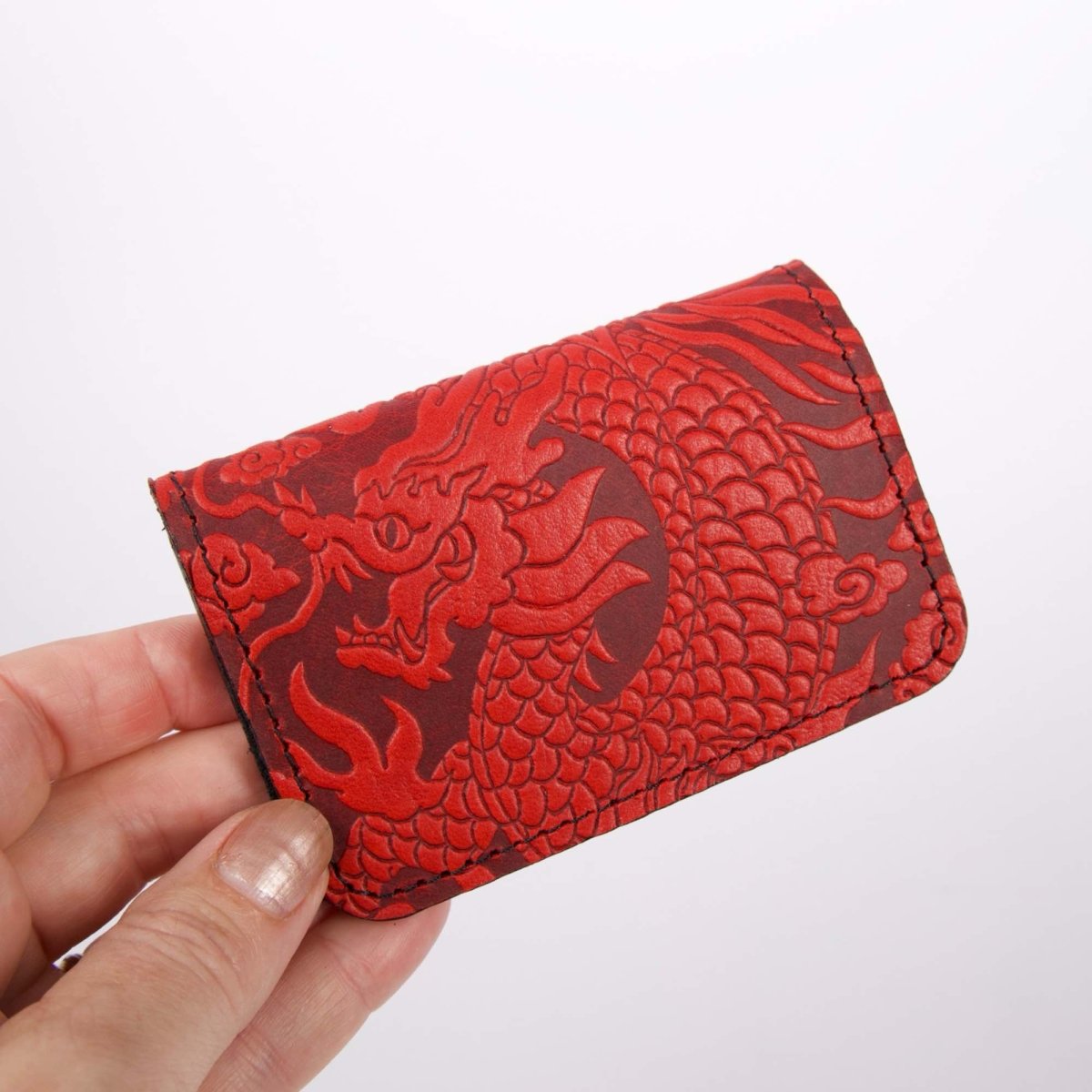 Cloud Dragons Mini Wallet, Red hand holding