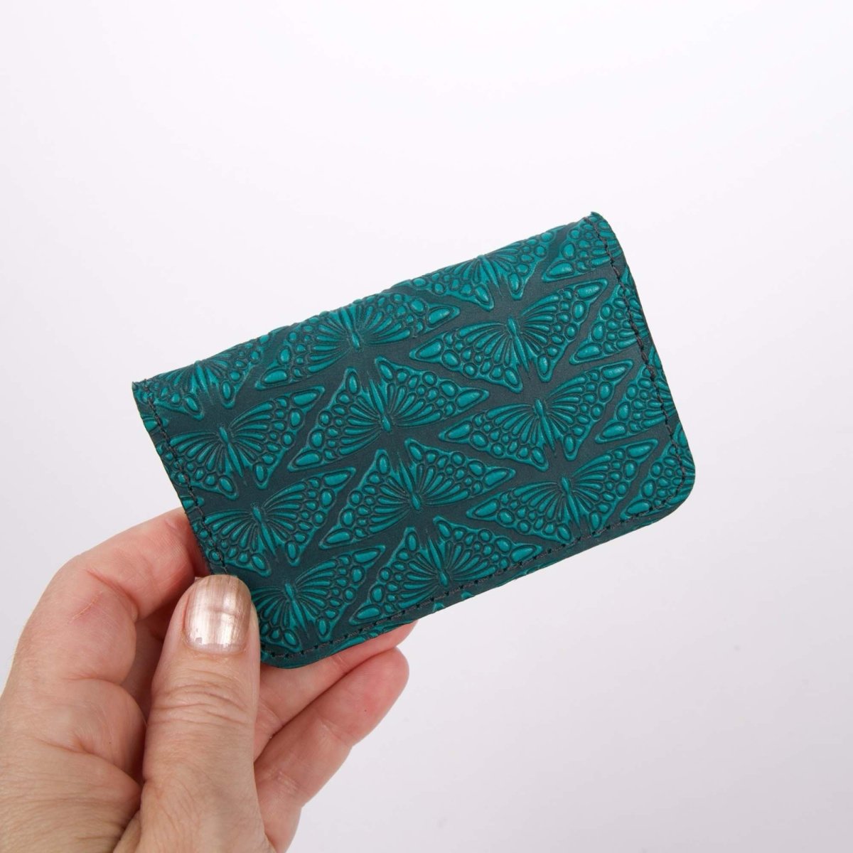 Mariposas Mini Wallet, Teal hand holding