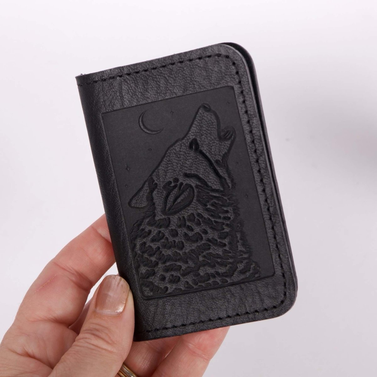 Singing Wolf Card Holder Mini Wallet, Black hand holding