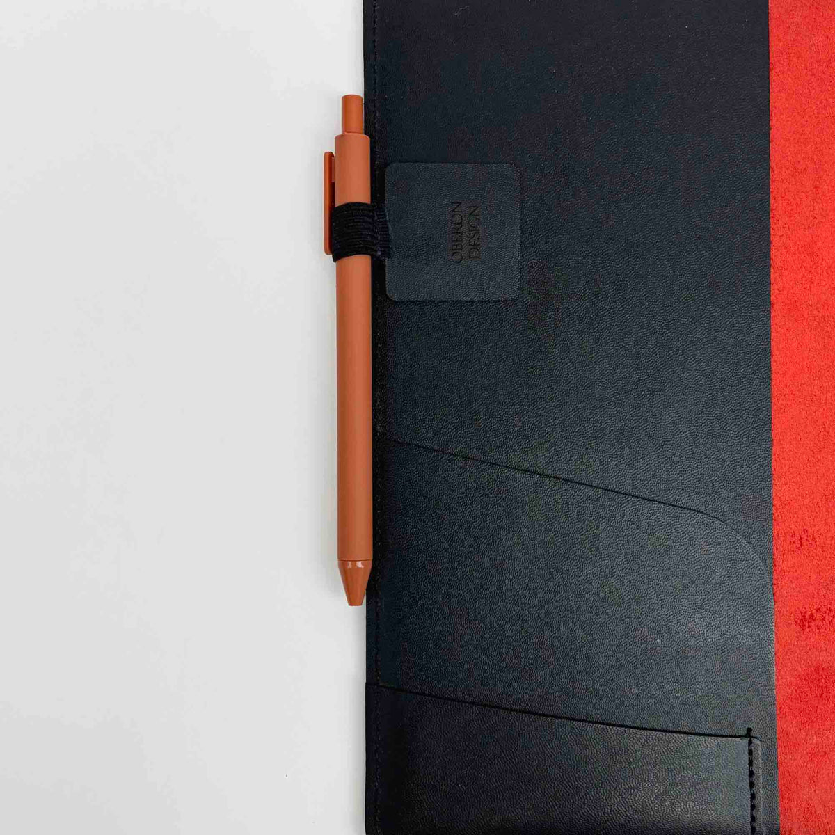 Adhesive pen loop on an Oberon Design composition notebook