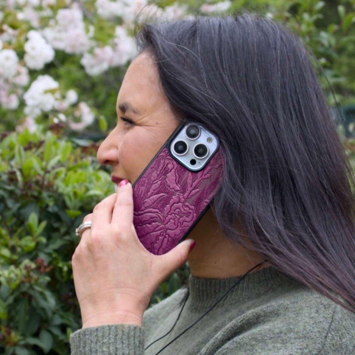 Leather iPhone Case, Iris in hand with flower background