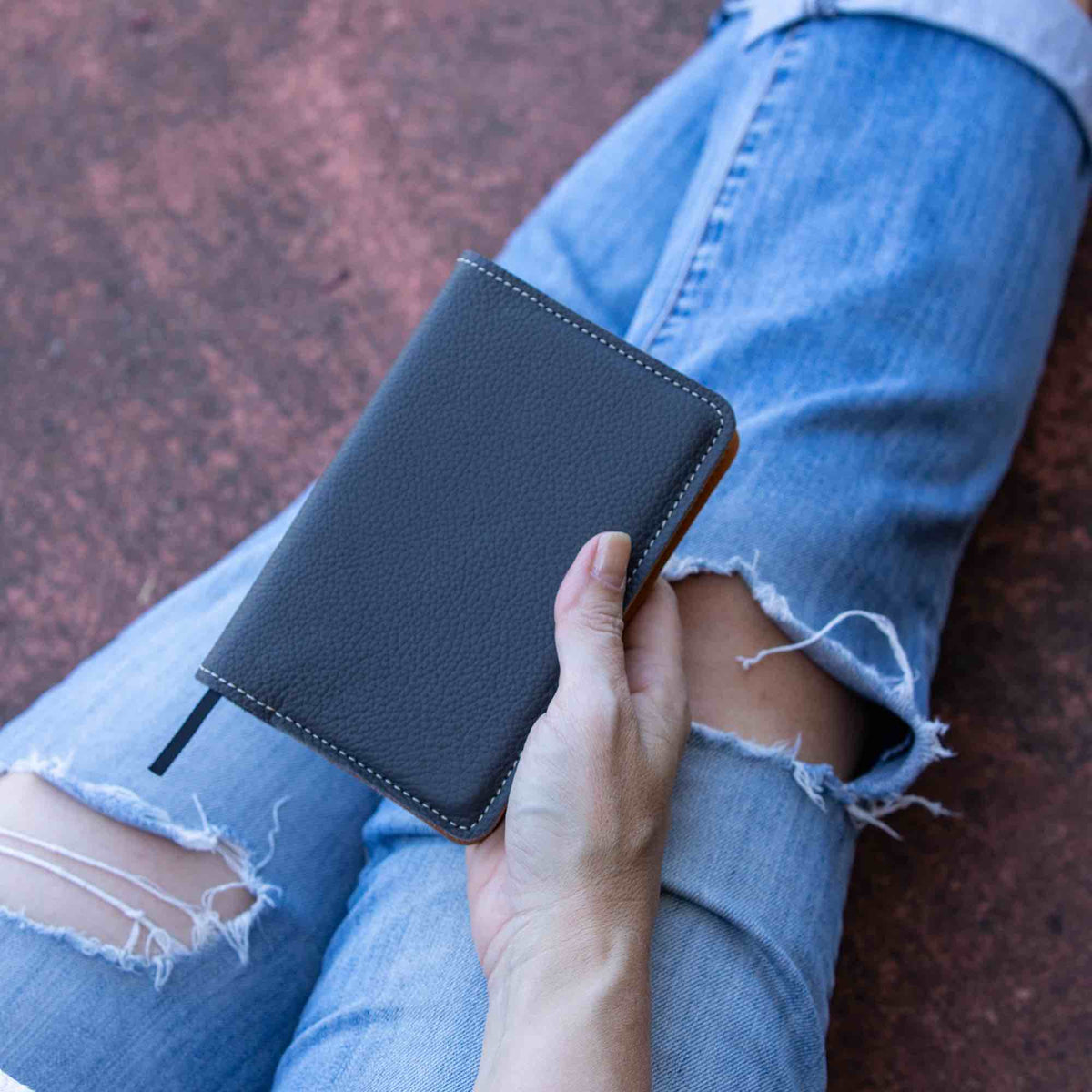 Oberon Design Pocket Notebook with Pacific Leather in Charcoal, Holding Lifestyle