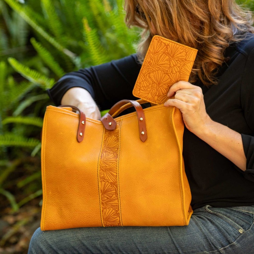 Leather Tote, Sonoma, Adventure, Ginkgo in Amber with pocket notebook in hand