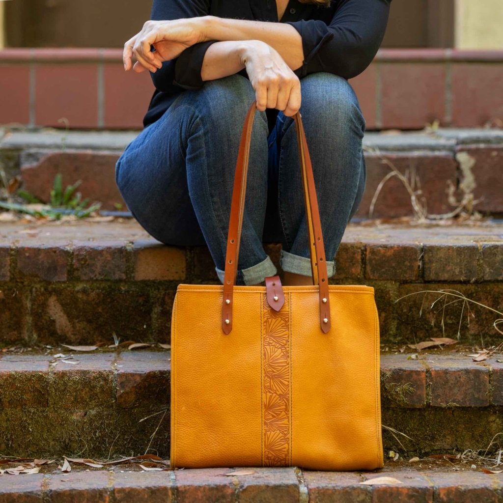 Leather Tote, Sonoma, Adventure, Ginkgo in Amber with model on steps