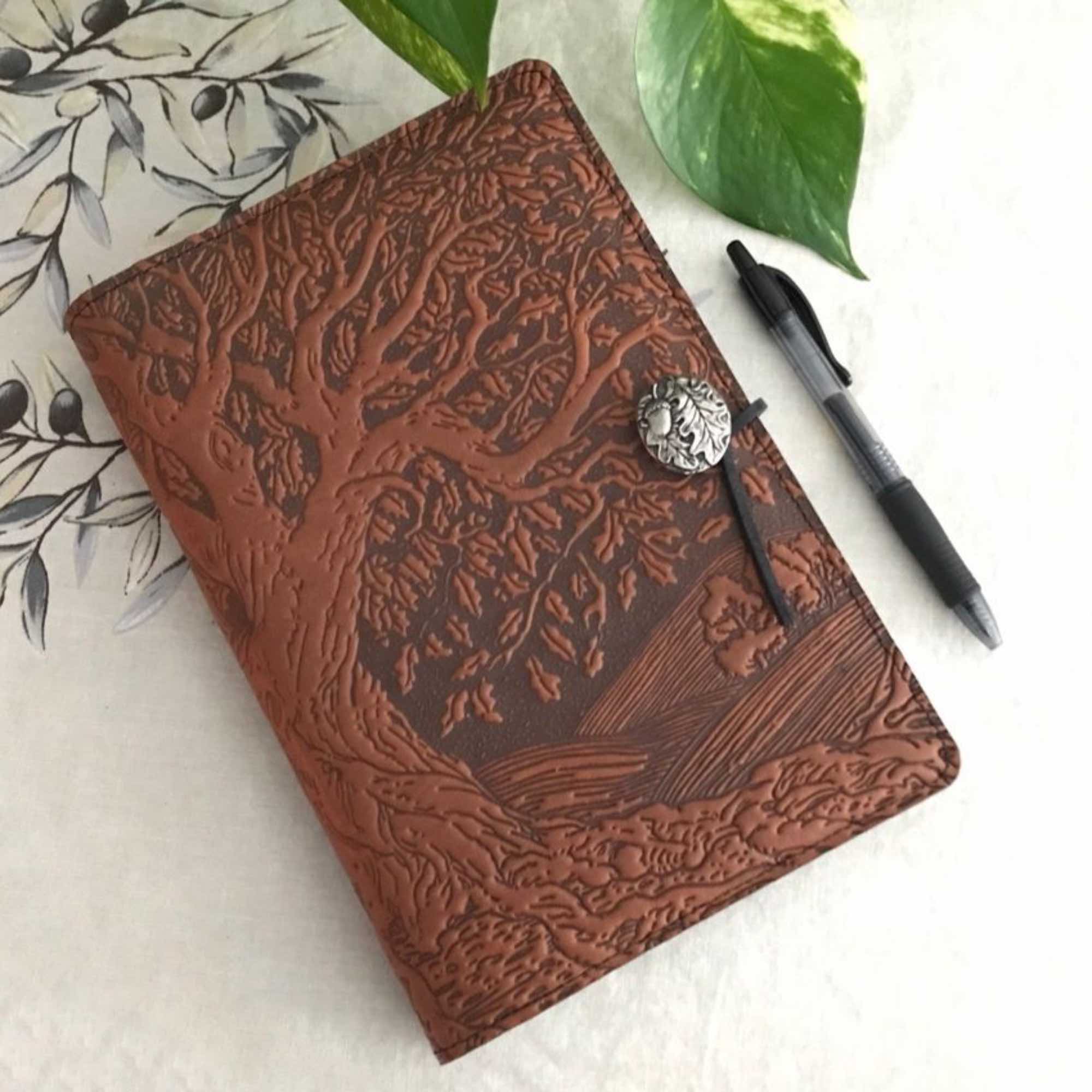 Leather Journal Tree of Life with pen on a table