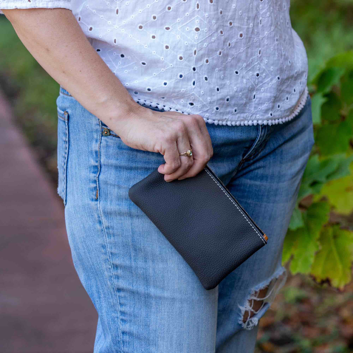 Oberon Design Zipper Pouch with Pacific Leather in Charcoal Hand Holding