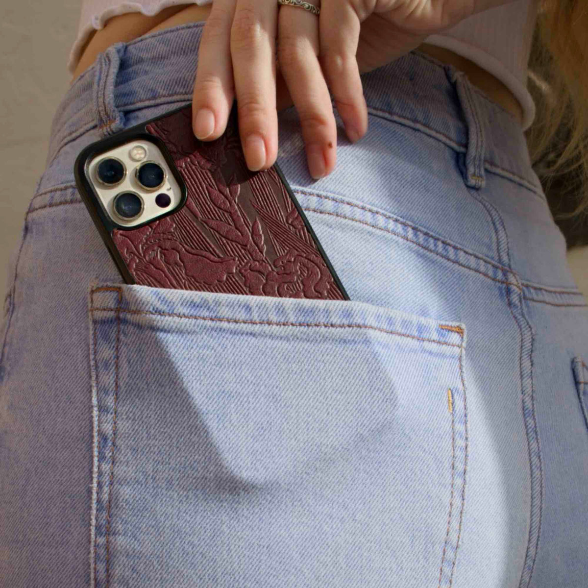 Leather iPhone Case, Iris in wine in back pocket